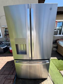 GE fridge with ice maker and water dispenser.