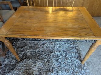 Sold wood table with iron detail