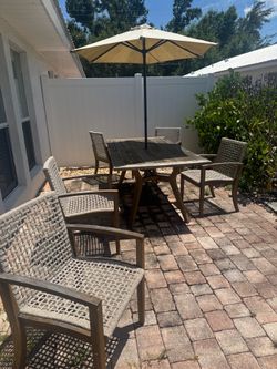 Wooden Outdoor Dining Set with 5 Woven Chairs and Umbrella