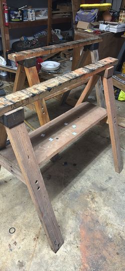 Two wooden saw horses