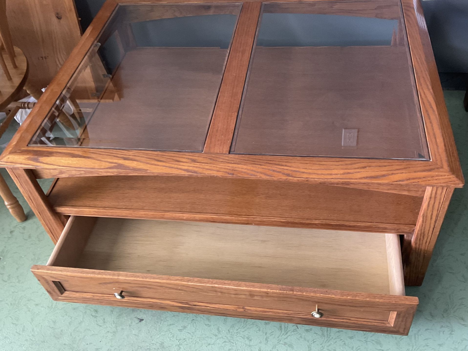 Oak coffee Table With Glass Top On Wheels.