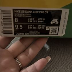 Nike SB Dunk Low Pro QS “White / Metallic Gold” (Sean Cliver holiday release).