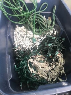 Two full of Christmas lights and extension cords everything goes for $60
