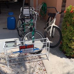 Multiple Items… 2 24” Bikes $60 & $90, Oars $20, Bike Rack $18, Bun & Thigh Roller $ 20, Scale $5, Shoe Rack $3