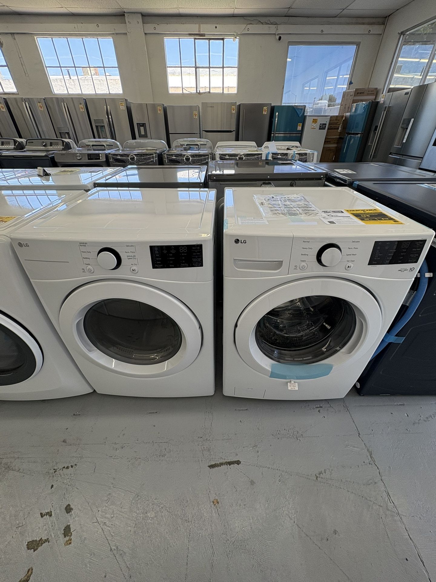LG 5.0 cu. ft. Stackable Front Load Washer with 6 Motion Cleaning Technology And 7.4 cu. ft. Vented Stackable Gas Dryer in White with Se