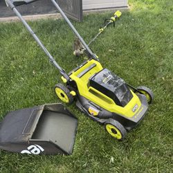 Battery Powered Lawn Mower And Weed Whacker 