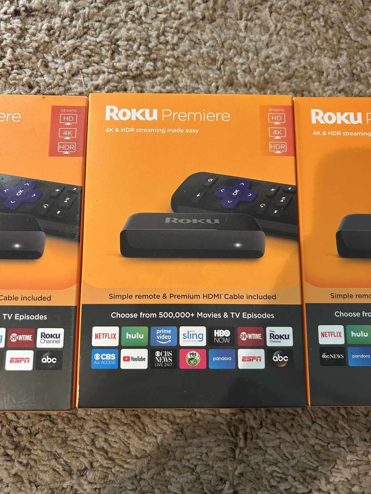 Three unopened Roku Premiere 4K