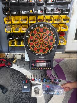 Dartboard with all the tips and darts