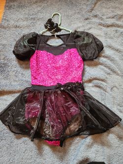 Dance Costume. Hot pink and black sequence with hair piece. Size 10-12