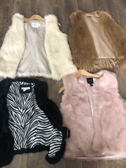 Furry vests $15 each excellent condition