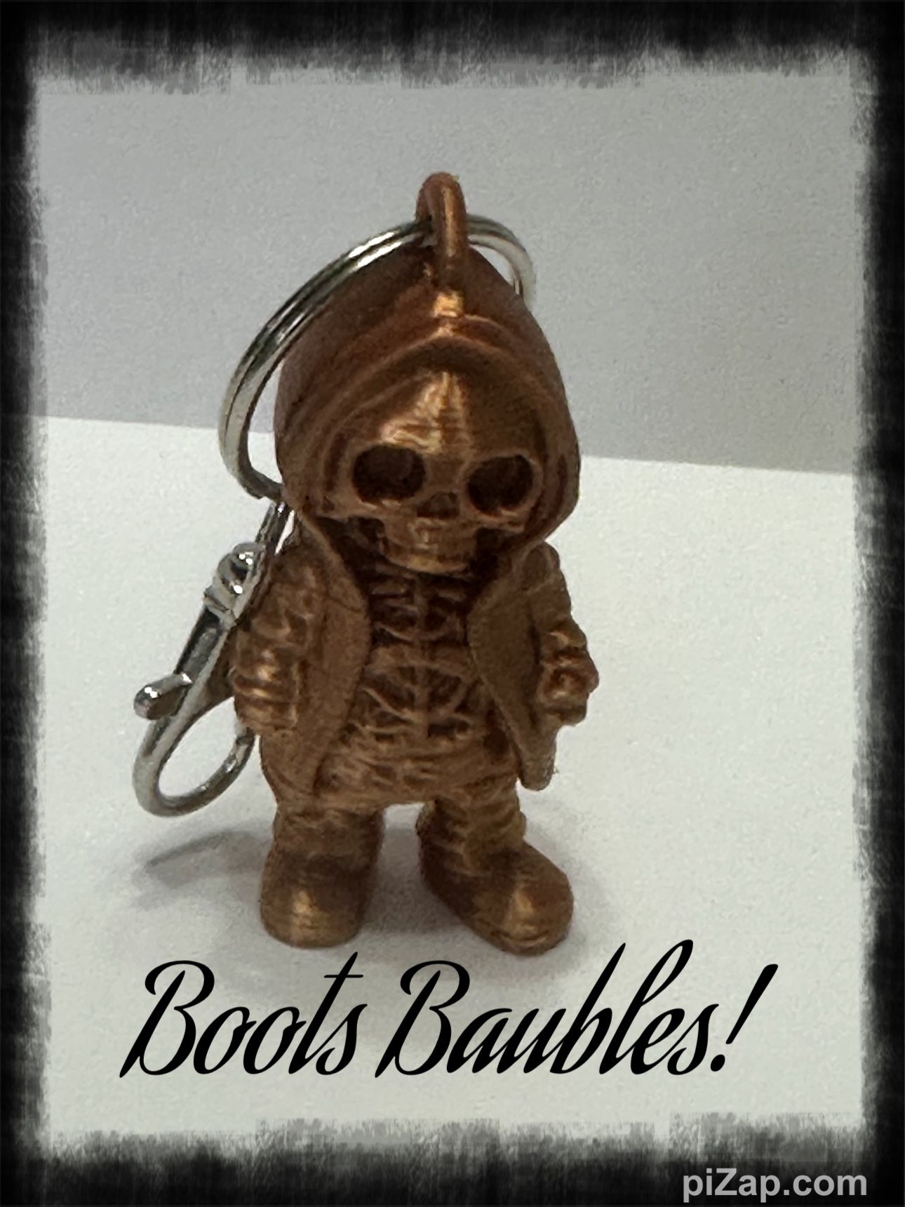 Copper Colored Skeleton Wearing A Hoodie Keychain Purse Clip
