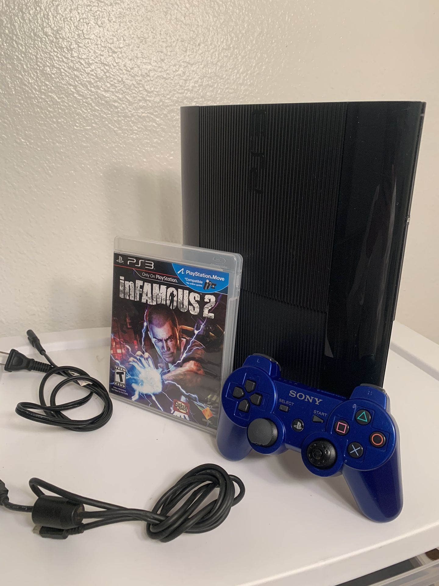 Super Slim (latest model) PS3 w/ Wiresless Remote + Infamous 2