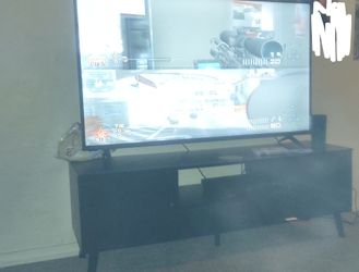 Entertainment center and 58" smart Vizio tv only 1 month old moving outta state can't take take both $300 obo