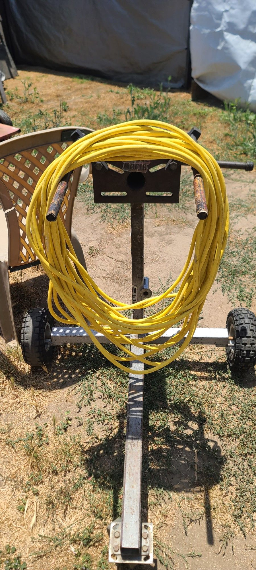 100 foot 12-3 120v Has standard household plugs Commercial grade extension cord