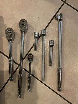 Snap on tools 3 ratchet,4 extensions, 1 swivel breaker bar, 2 set of sockets selling altogether firm