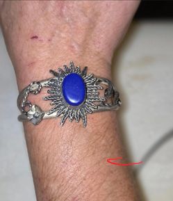 Mexican silver bracelet with blue oval stone with sunburst design