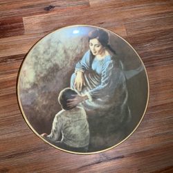 This fine porcelain decorative plate titled "Dear Child" (1974) was designed by Irene Spencer for Gorham.
