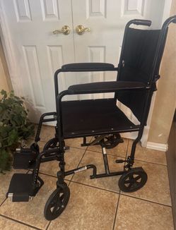 Medical transport chair. Folds quick , easily  & compact. 19 “seat,  300 lb.  capacity weight  hand breaks