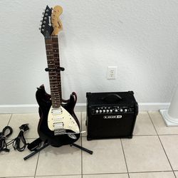 Two electric guitars. One Brownsville and Squier, plus Amplifier Line 6. Everything in good condition.