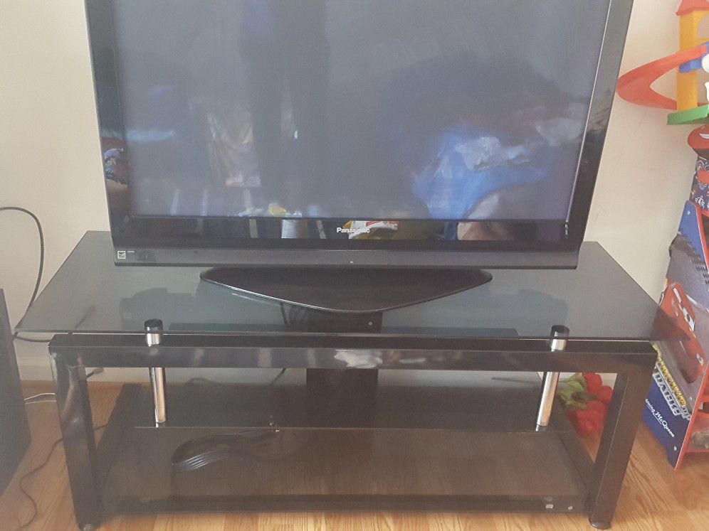 42' Panasonic HD tv with nice table for it