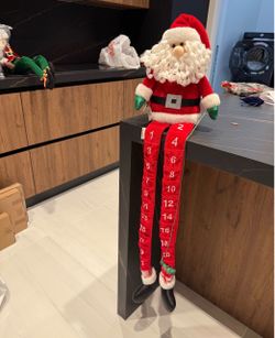 Santa Claus Christmas calendar with red fabric and white numbers
