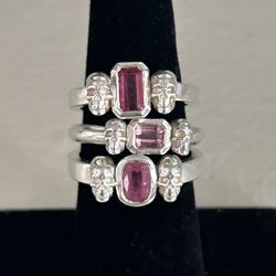 Custom made sterling, pink, tourmaline, and skull rings.