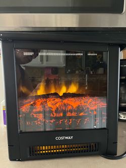 Room Heater burning logs light up