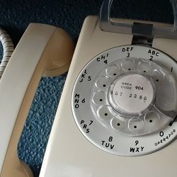 Mounted Yellow Rotary Telephone