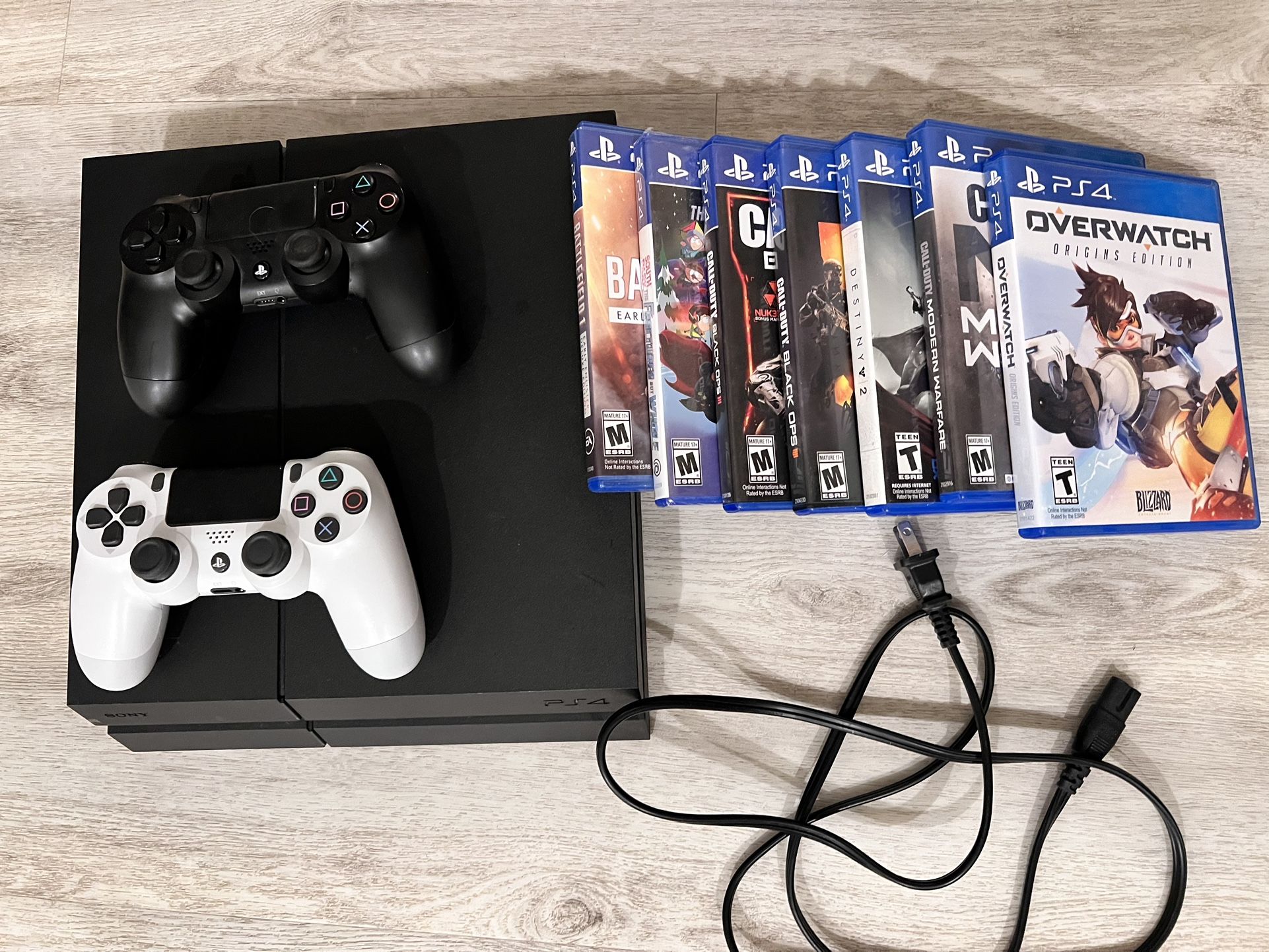 PS4 500 GB With Cords, 2 Controllers, And 7 Games