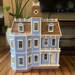 Large furnished wooden dollhouse