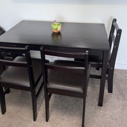 Sleek Black 4-Seater Dining Table – Stylish, Compact, & Comfortable
