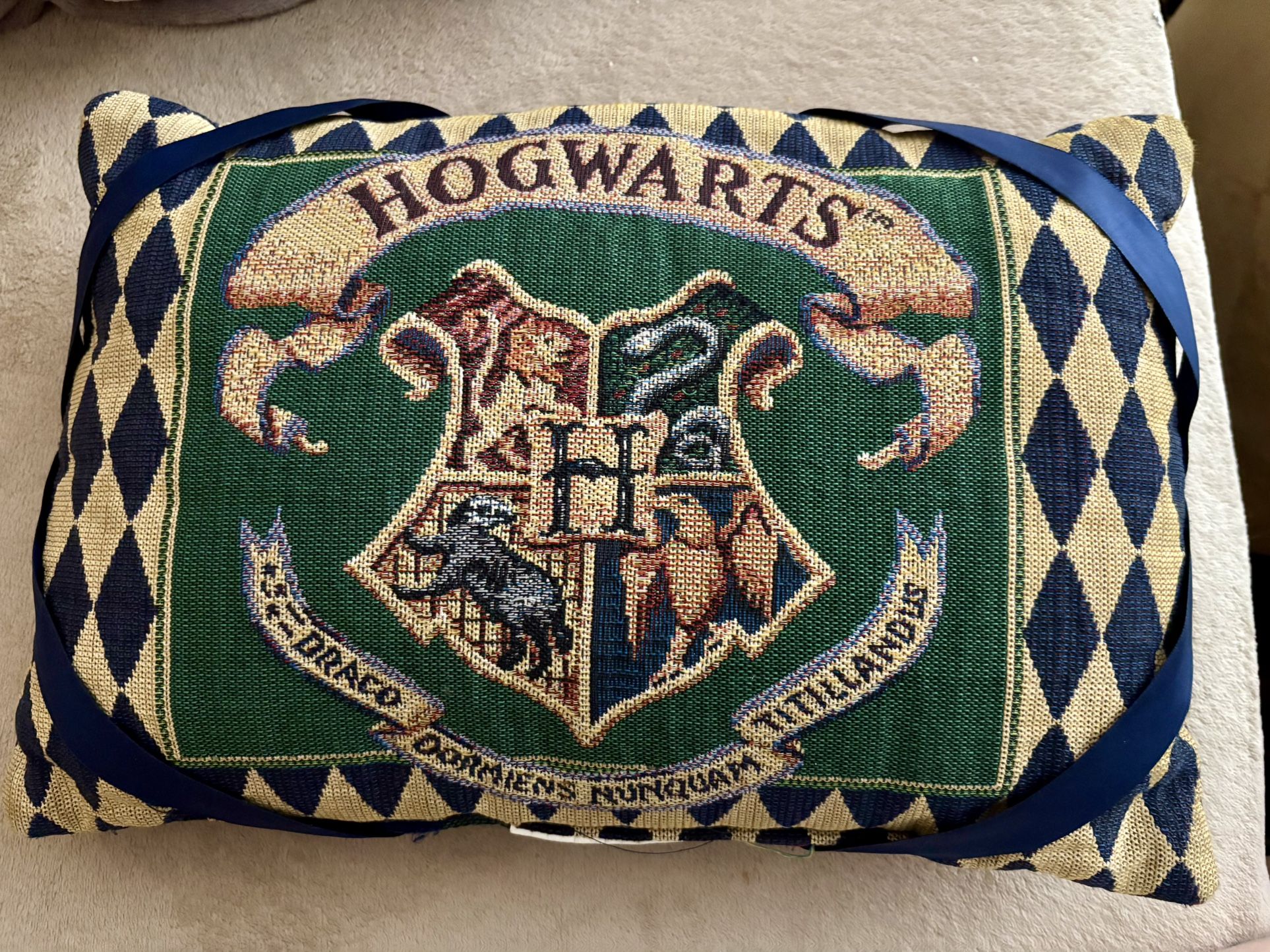 This is a vintage Harry Potter Hogwarts Crest Throw Pillow