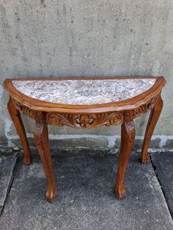 Elegant half-moon console table.
