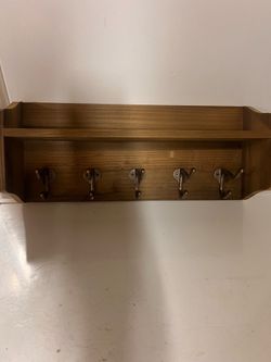 Wooden shelf with hooks