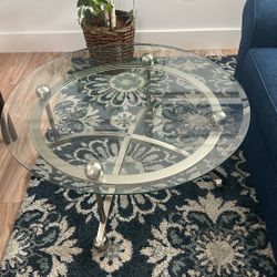 Small Glass Round Table, Fake Plant And Wall Pictures