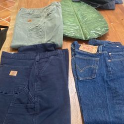 Men’s pants, one pair of Levi’s two pairs of Carhartt heavy work pants