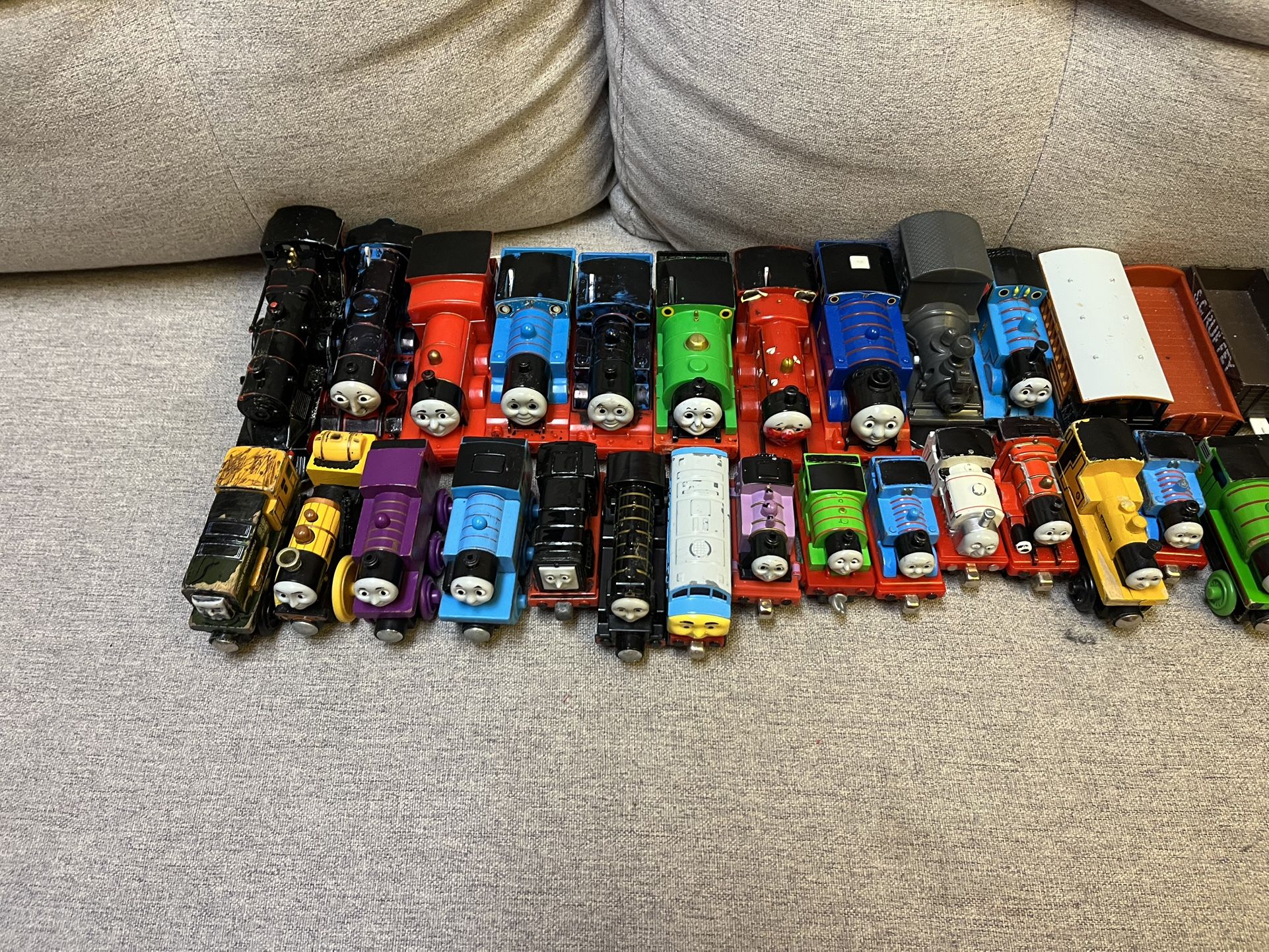 Lot of Thomas the Choo Choo Train toys and trans. Multiple trains, cars, etc