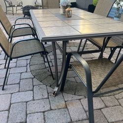 Patio Table With Tile Pieces And 6 Chairs $100