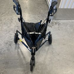 Carex 3 Wheel Rollator Black With  Bag And Dual Breaks 250 Lbs Max Adjustable. Used in good condition with minor cosmetic, blemishes associated with n