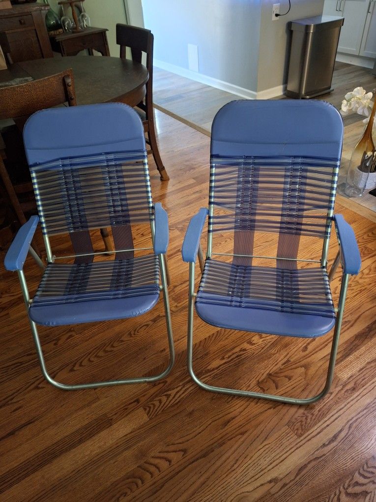 Two Vinyl Folding Lawn Chairs