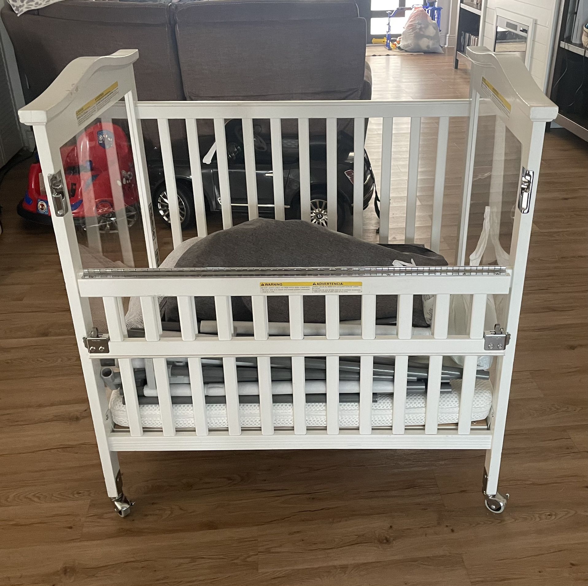 Co-Sleeper Mini Crib with Wheels WITH Light Up Mobile/ Newton Baby Mini Crib Mattress 
