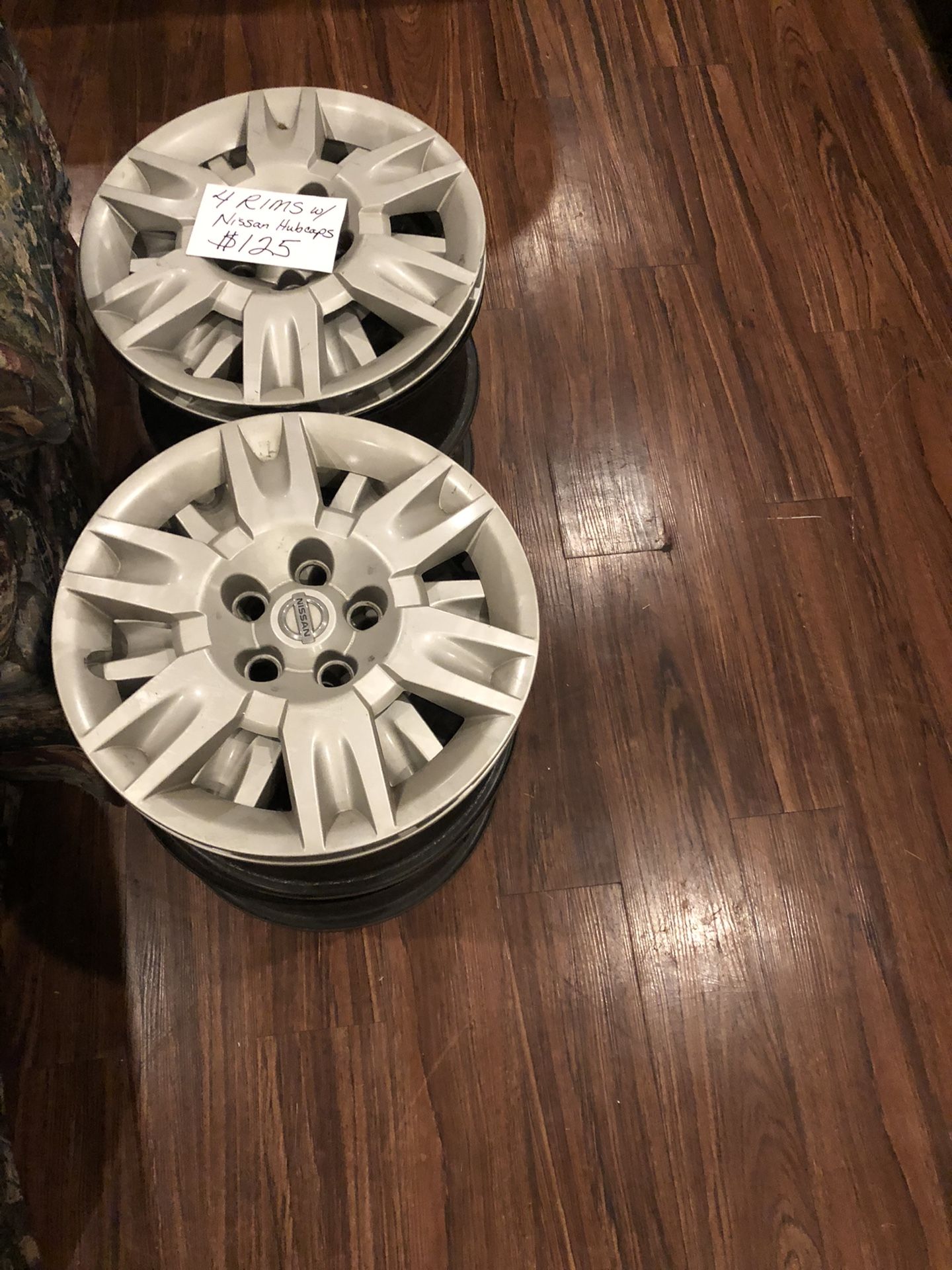 Four rims with Nissan
