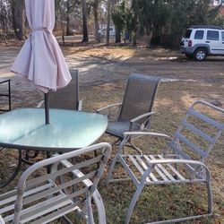 Table Chairs And Umbrella
