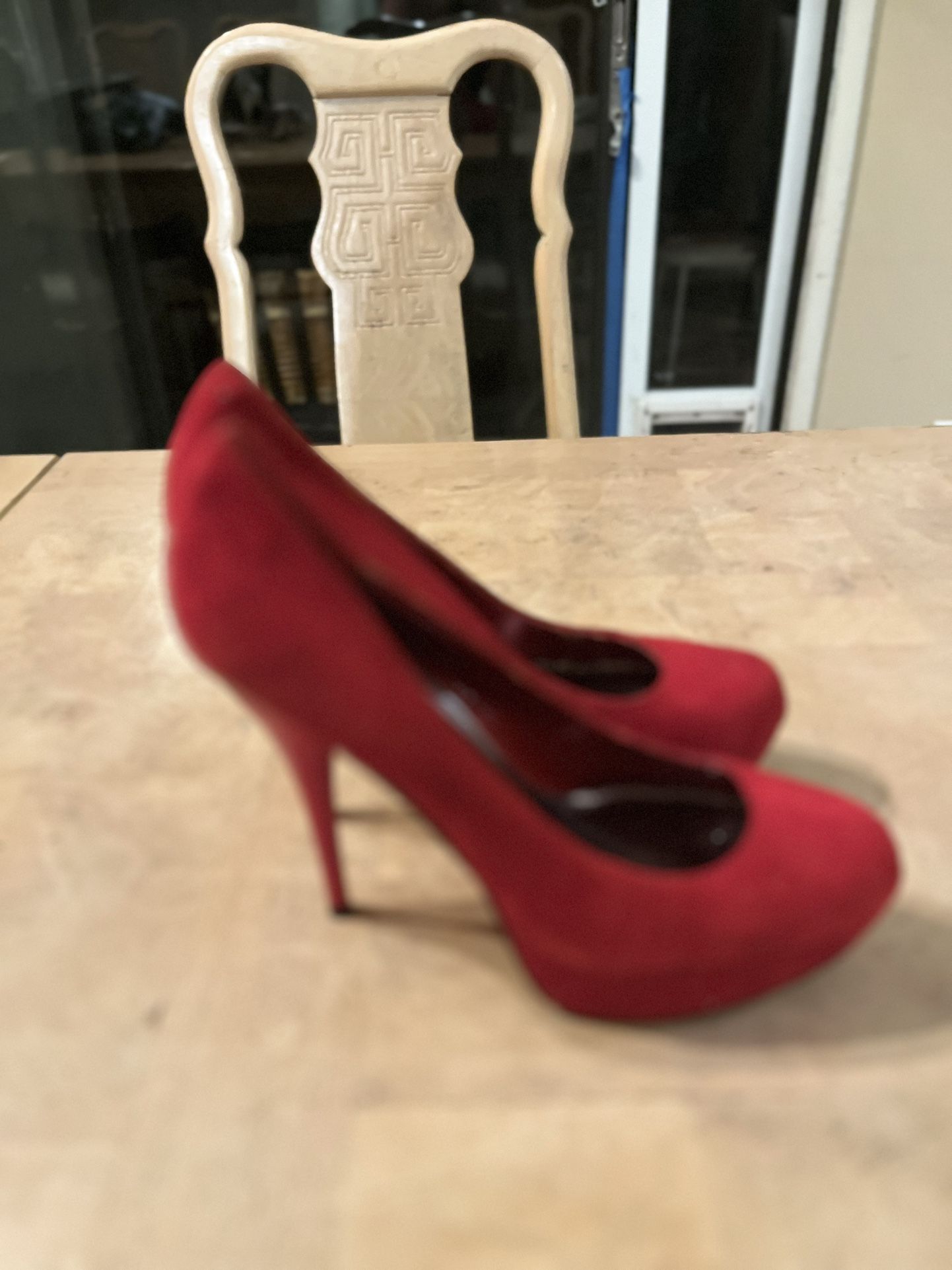 Bright red suede stiletto style heels