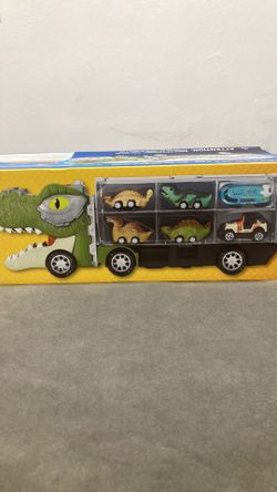 Toy dinosaur carrier truck