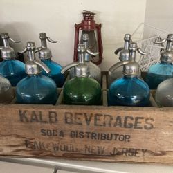 Antique Seltzer Bottles In Crate