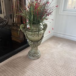 Decorative vase with artificial red flowers