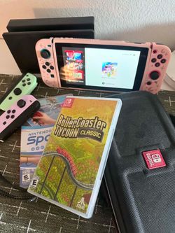 Nintendo switch with games and controllers