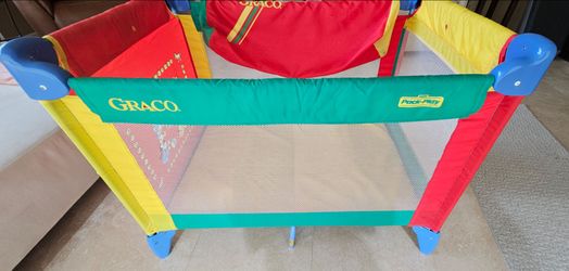 Graco Pack 'n Play Playard with a travel cover
