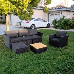 6 piece outdoor patio furniture sectional with a club chair and glass coffe take b